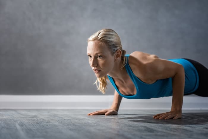 athletic woman doing push ups